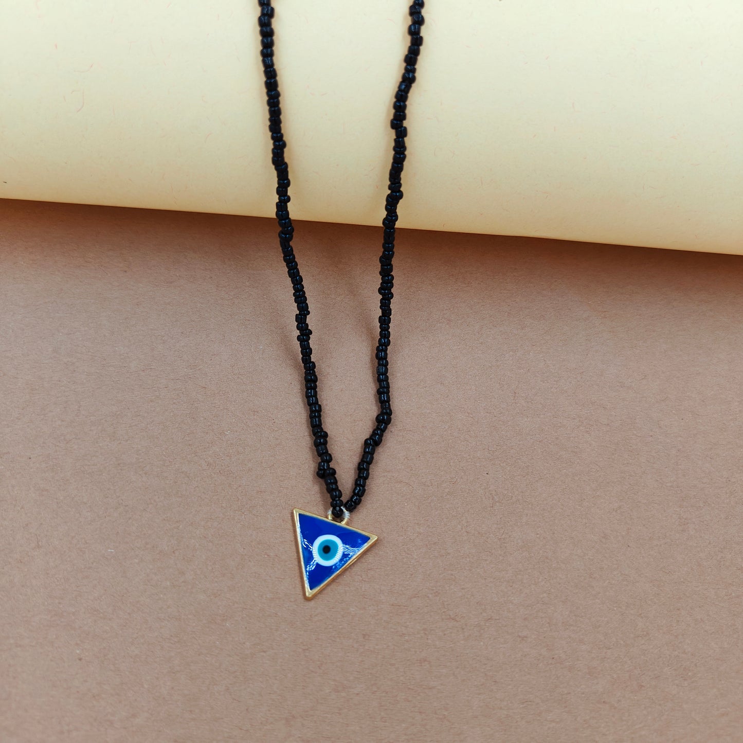 Blue evil eye triangle necklace
